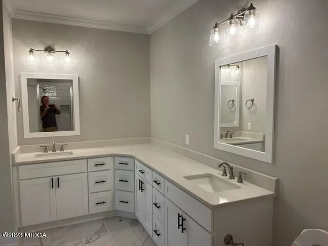 a bathroom with double sink and a mirror
