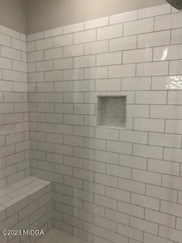 a bathroom with a white toilet