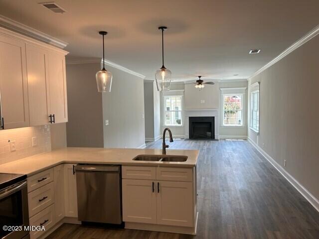 2203 Exchange Drive Macon, GA 31210 - Photo 2 of 16 a kitchen with sink cabinets and fireplace