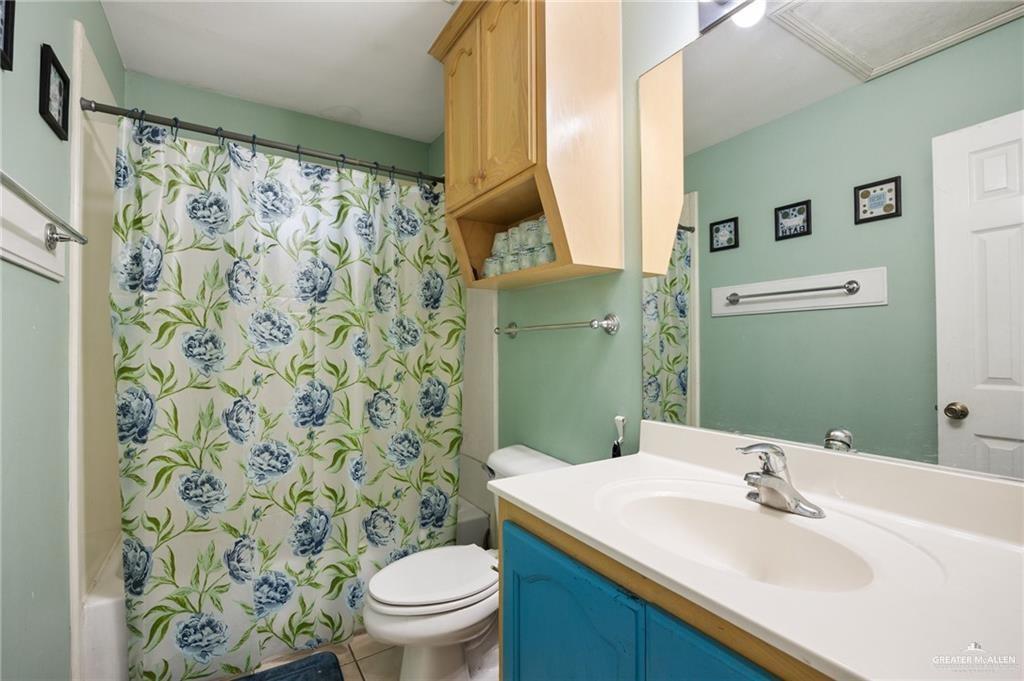 1504 Prosperity Drive, Unit 1 Edinburg, TX 78541 - Photo 14 of 18 a bathroom with a sink and a mirror