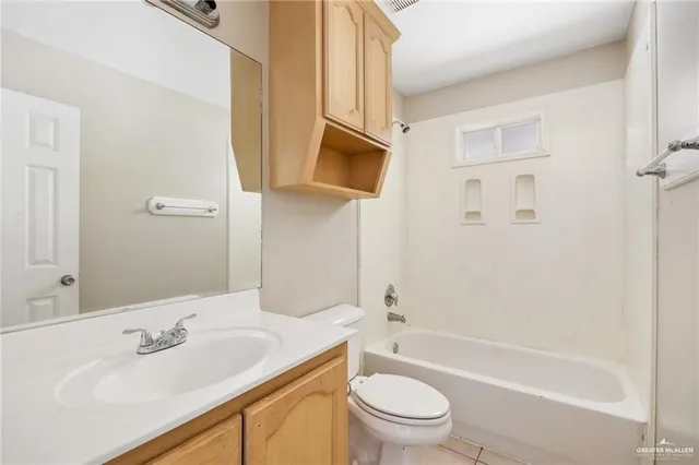 a bathroom with a sink a toilet and bathtub