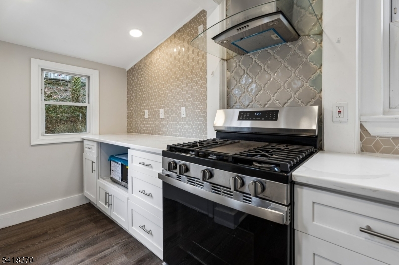 32 Edgewood Road Glen Ridge, NJ 07028 - Photo 11 of 32 a kitchen with a stove and a wooden floor