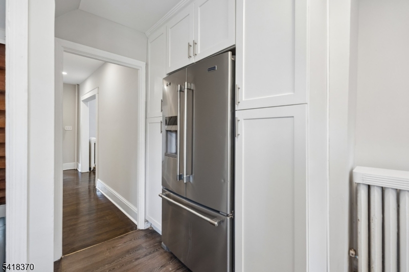 32 Edgewood Road Glen Ridge, NJ 07028 - Photo 13 of 32 a view of a hallway with wooden floor and a refrigerator