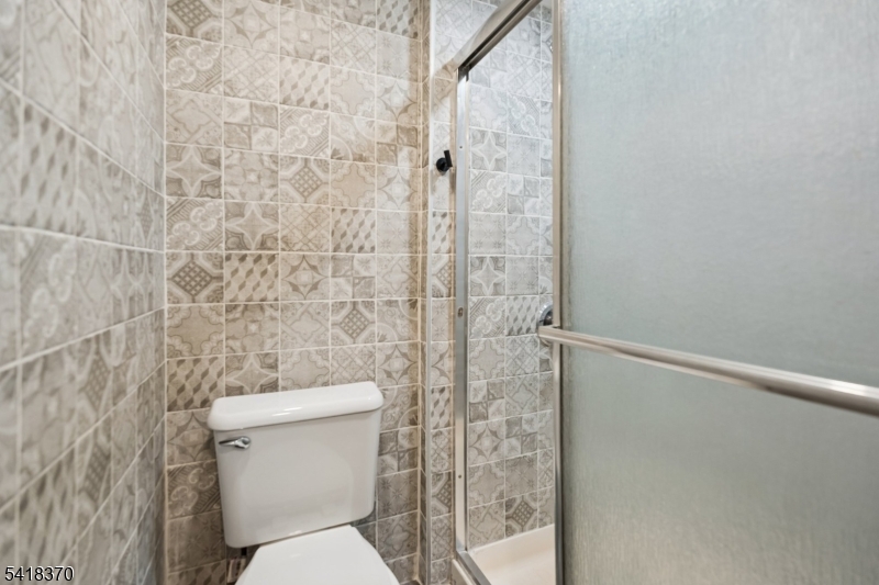 32 Edgewood Road Glen Ridge, NJ 07028 - Photo 20 of 32 a white toilet sitting next to a shower