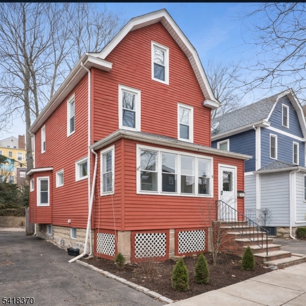 32 Edgewood Road Glen Ridge, NJ 07028 - Photo 2 of 32 a front view of a house with a yard