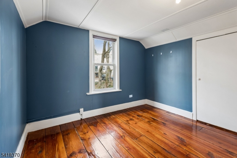 32 Edgewood Road Glen Ridge, NJ 07028 - Photo 23 of 32 an empty room with wooden floor and windows