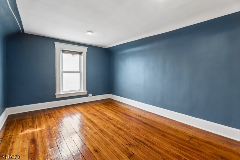 32 Edgewood Road Glen Ridge, NJ 07028 - Photo 24 of 32 a view of empty room with wooden floor and fan
