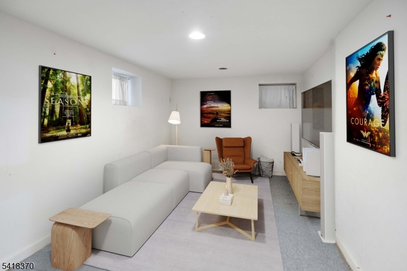 32 Edgewood Road Glen Ridge, NJ 07028 - Photo 25 of 32 a living room with furniture and a painting on the wall