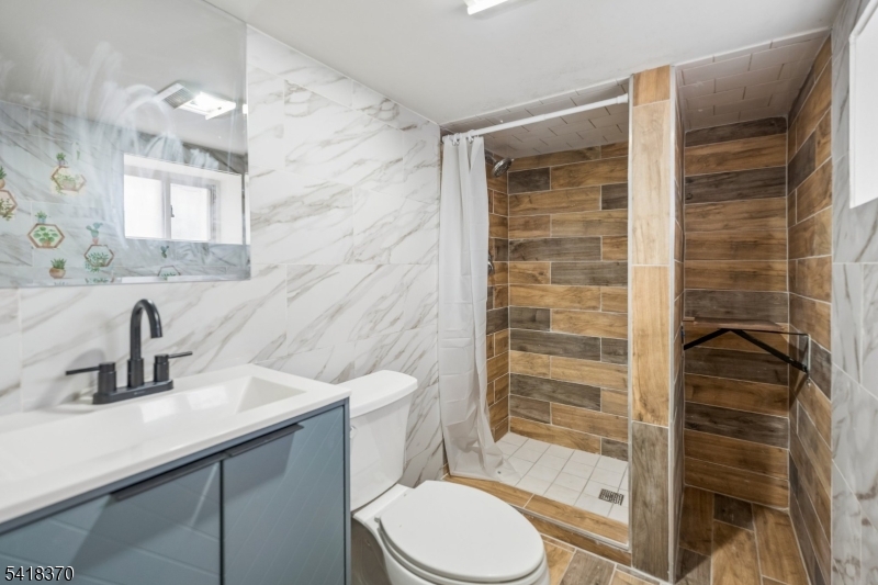 32 Edgewood Road Glen Ridge, NJ 07028 - Photo 26 of 32 a bathroom with a sink toilet and shower