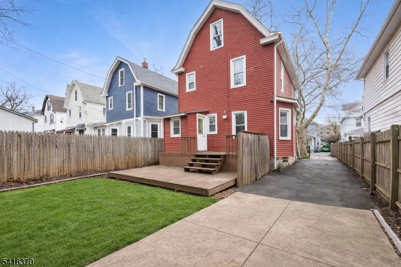 32 Edgewood Road Glen Ridge, NJ 07028 - Photo 30 of 32 a front view of a house with a yard