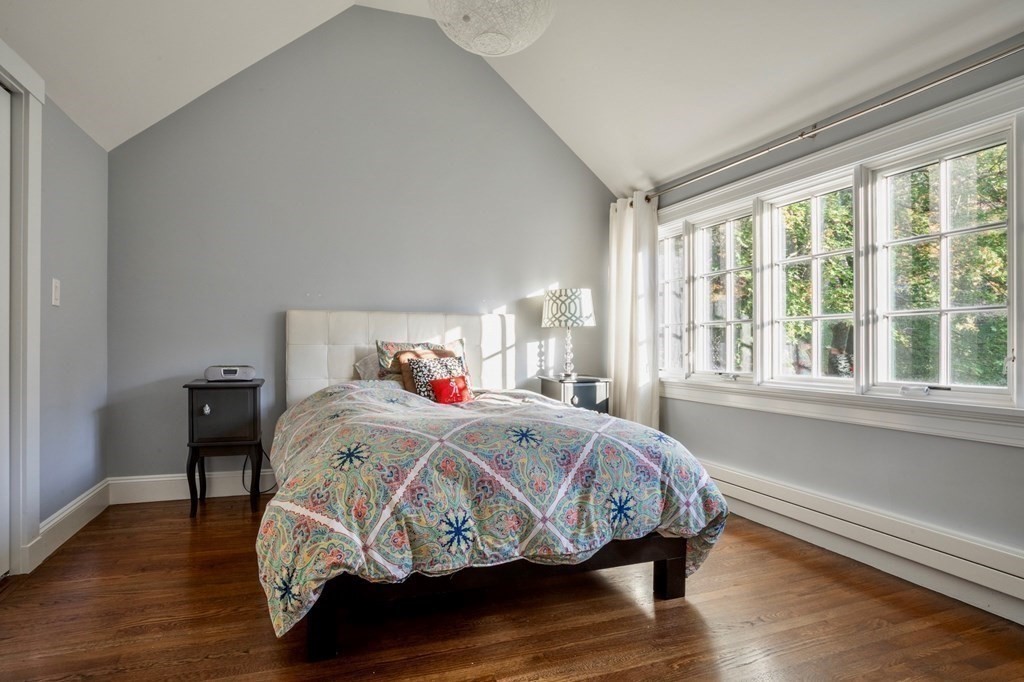 185 Franklin Street Newton, MA 02458 - Photo 18 of 23 a bedroom with a bed and wooden floor