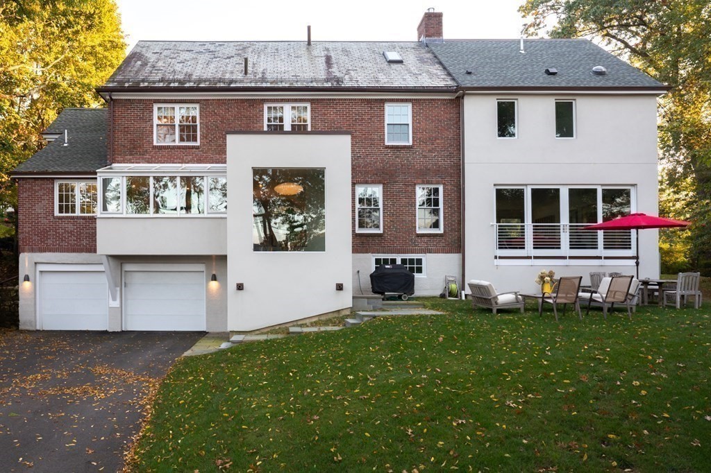 185 Franklin Street Newton, MA 02458 - Photo 23 of 23 a front view of a house with a yard and garage