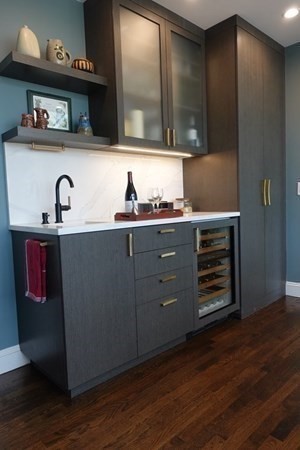 185 Franklin Street Newton, MA 02458 - Photo 10 of 23 a kitchen with stainless steel appliances a stove and wooden floor