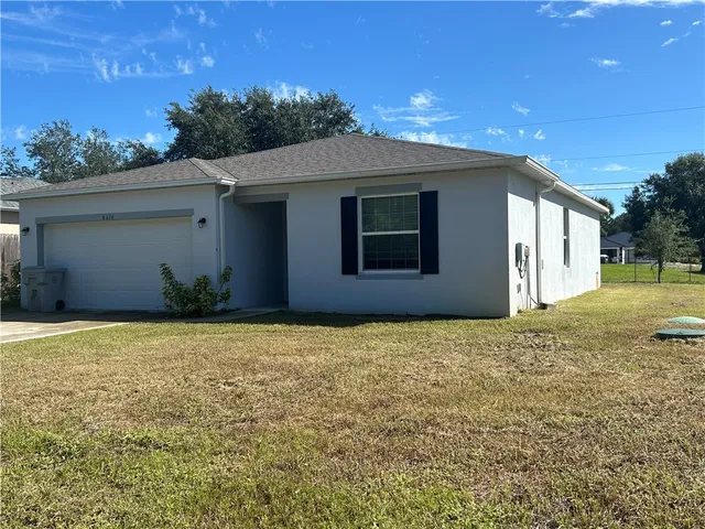 a house view with a backyard space