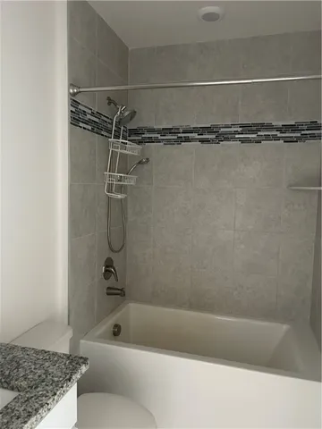 a bathroom with a shower and a bathtub