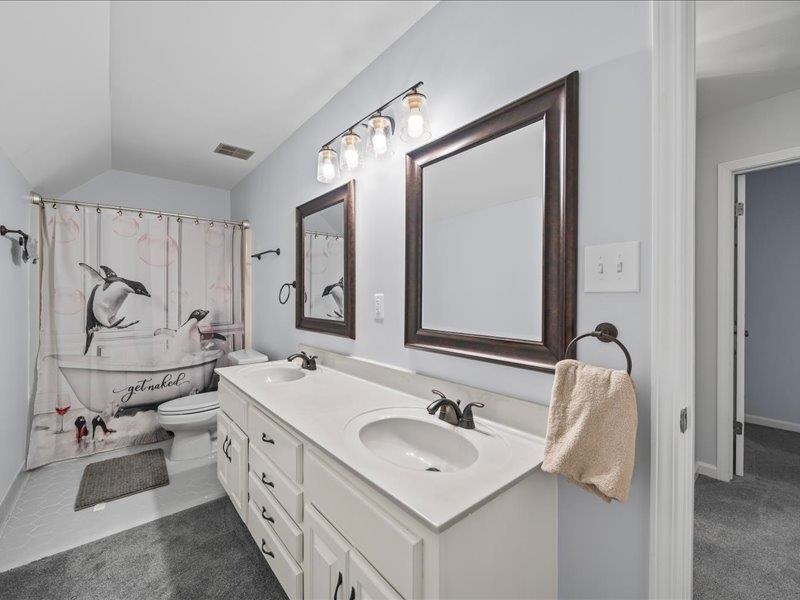 8104 Jack Bond Road Arlington, TN 38002 - Photo 24 of 40 a bathroom with a double vanity sink mirror and