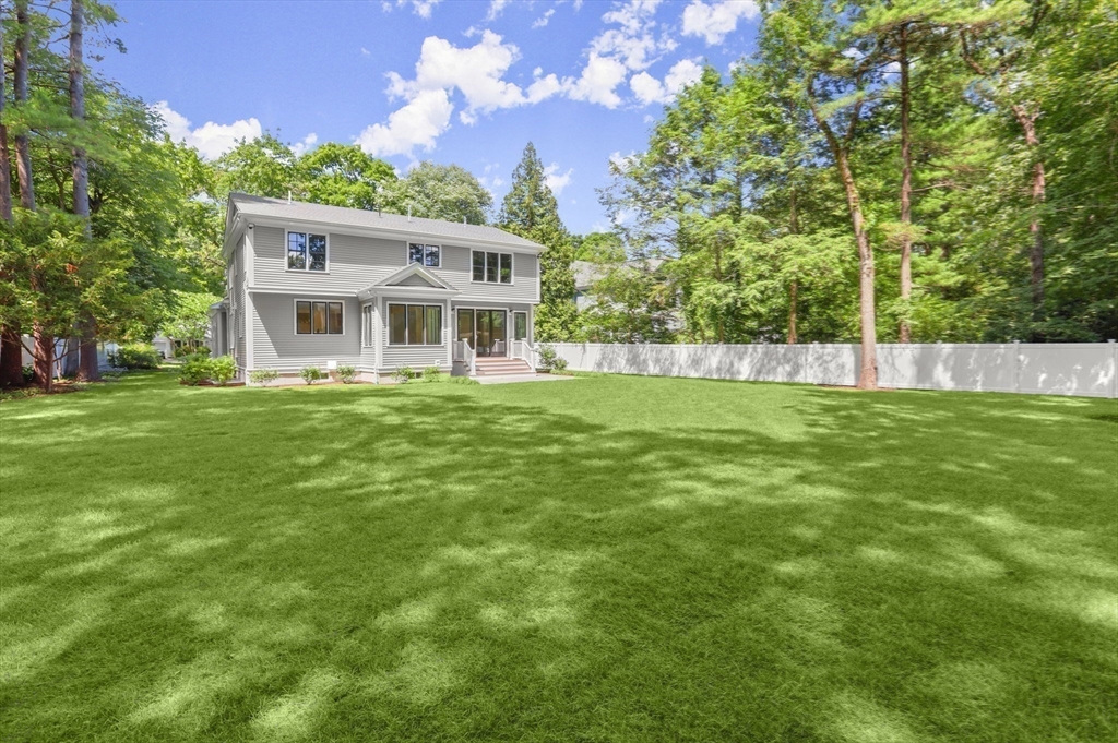 86 Parker Road Wellesley, MA 02482 - Photo 23 of 25 a view of a house with a big yard and large trees