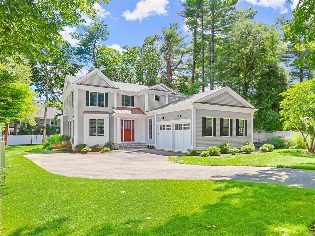 86 Parker Road Wellesley, MA 02482 - Photo 3 of 25 a front view of a house with a garden
