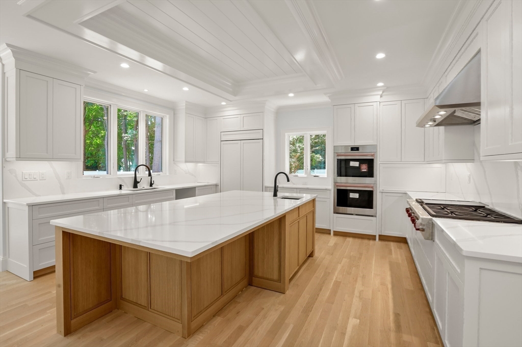 86 Parker Road Wellesley, MA 02482 - Photo 4 of 25 a large kitchen with stainless steel appliances granite countertop a large center island and a sink
