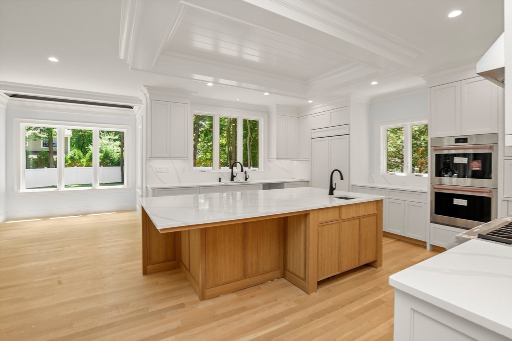 86 Parker Road Wellesley, MA 02482 - Photo 5 of 25 a large kitchen with stainless steel appliances granite countertop a sink and a stove