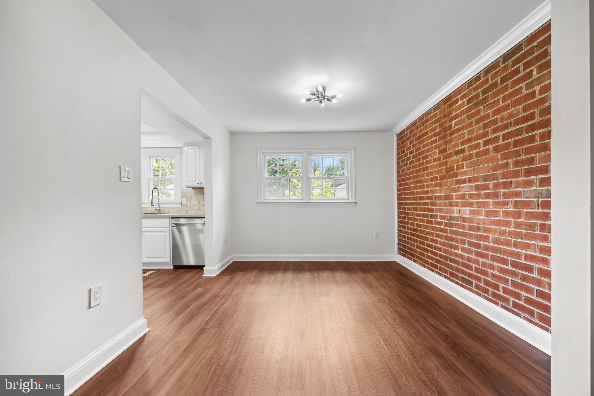 207 Yardley Commons Yardley, PA 19067 - Photo 11 of 19 a view of empty room with wooden floor and fan