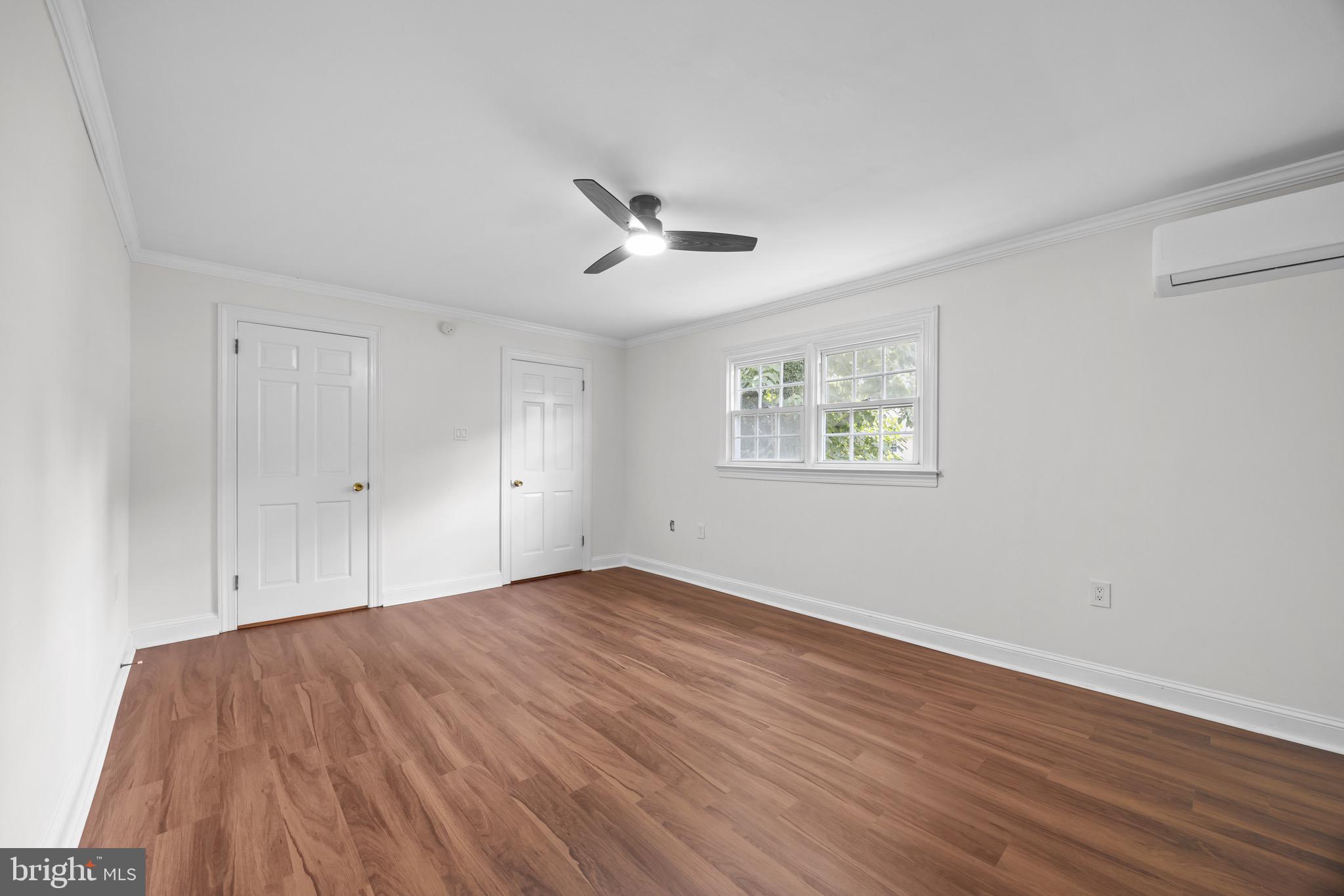 207 Yardley Commons Yardley, PA 19067 - Photo 12 of 19 a view of empty room with wooden floor and fan