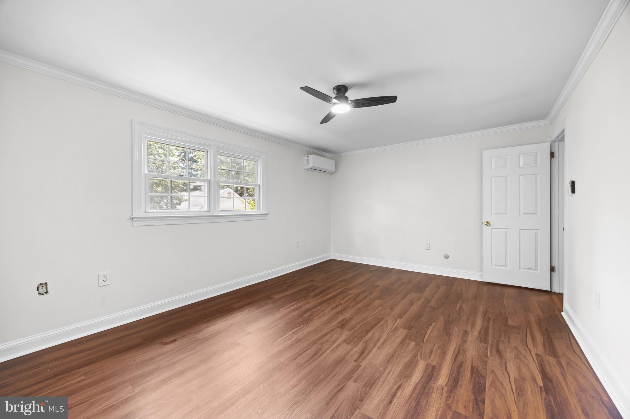 207 Yardley Commons Yardley, PA 19067 - Photo 13 of 19 a view of empty room with wooden floor and fan