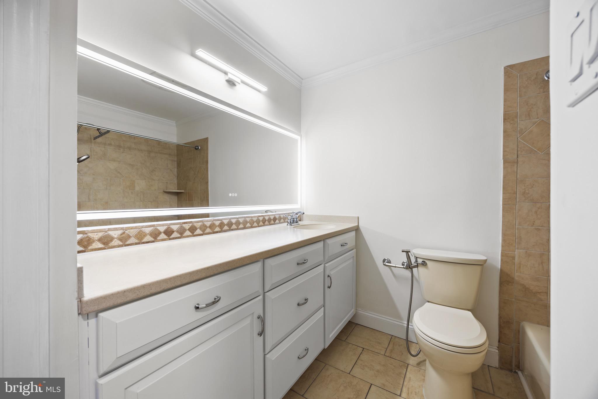 207 Yardley Commons Yardley, PA 19067 - Photo 14 of 19 a bathroom with a granite countertop toilet sink and mirror