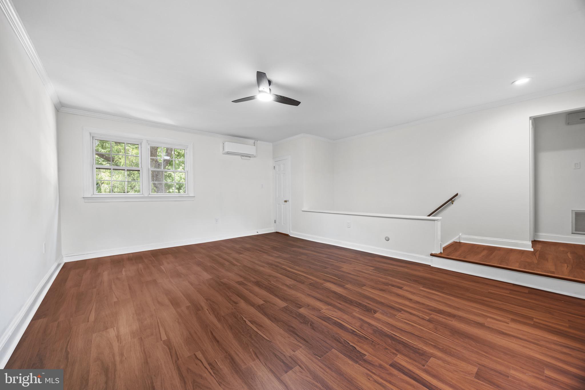 207 Yardley Commons Yardley, PA 19067 - Photo 10 of 19 a view of empty room with wooden floor and fan