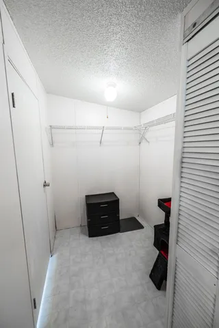 a bathroom with a shower and toilet