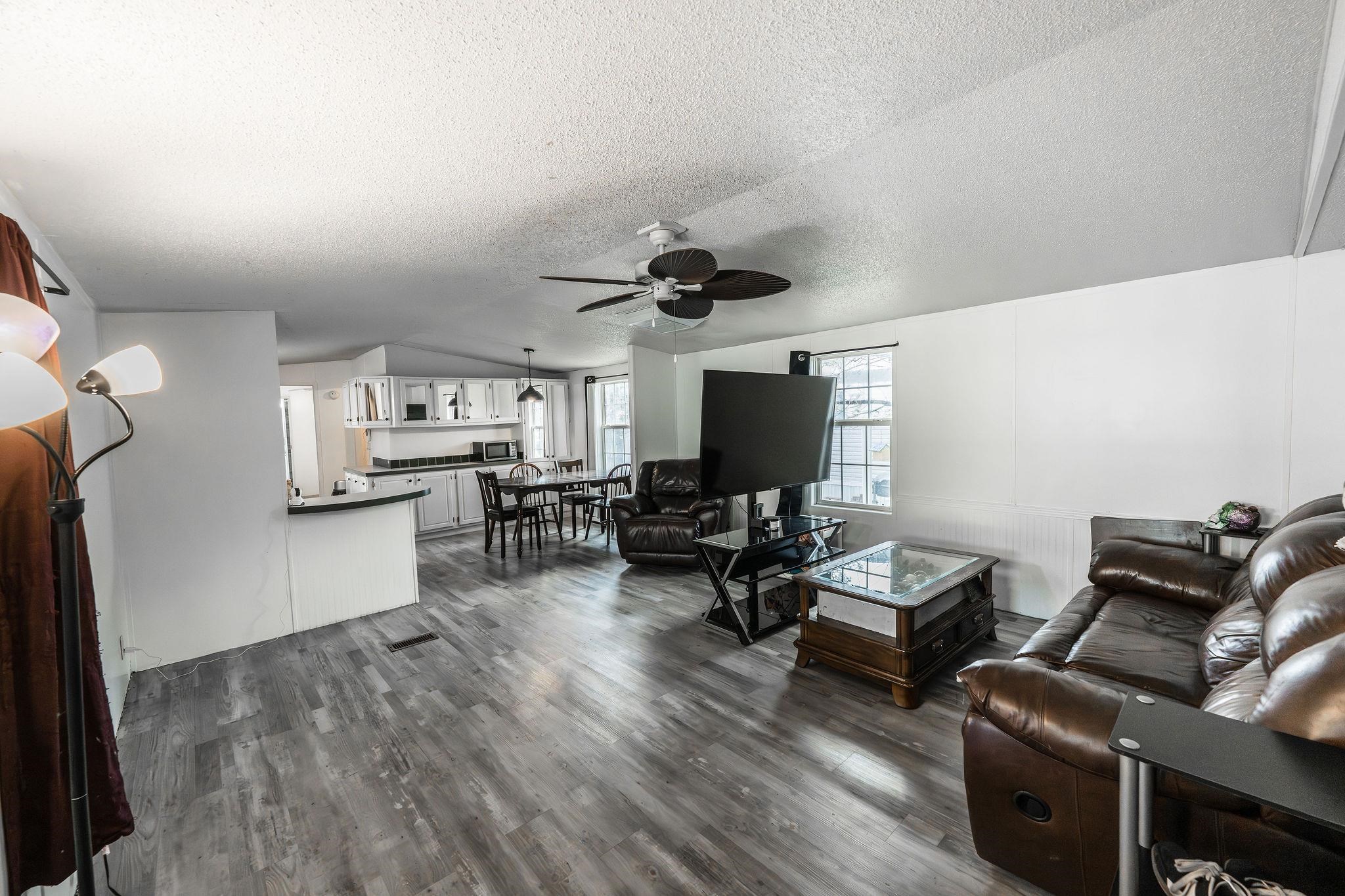 435 32 Road, Unit 620 Clifton, CO 81520 - Photo 3 of 20 a living room with furniture and a flat screen tv