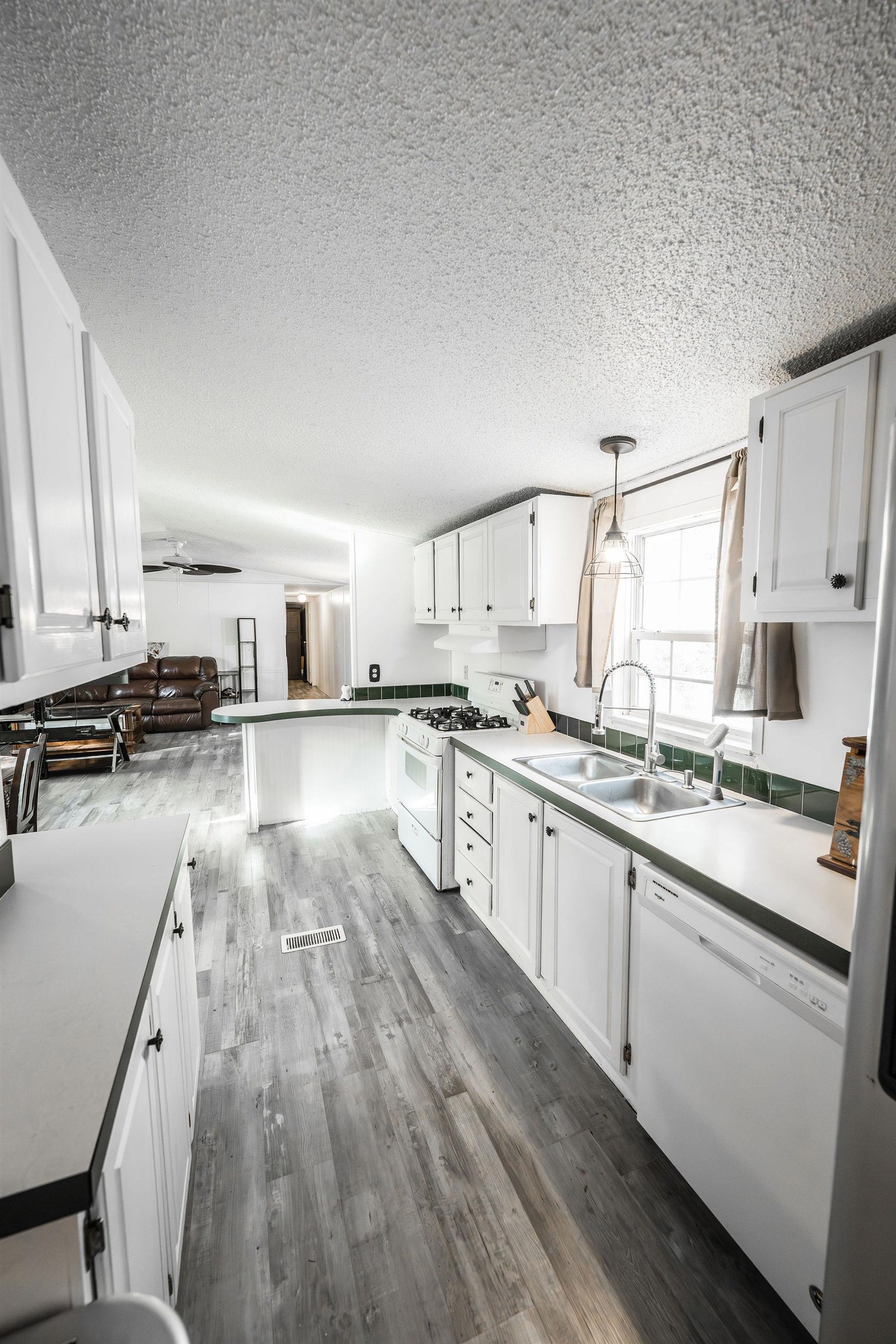 435 32 Road, Unit 620 Clifton, CO 81520 - Photo 8 of 20 a kitchen with stainless steel appliances a sink a stove top oven a counter space and cabinets