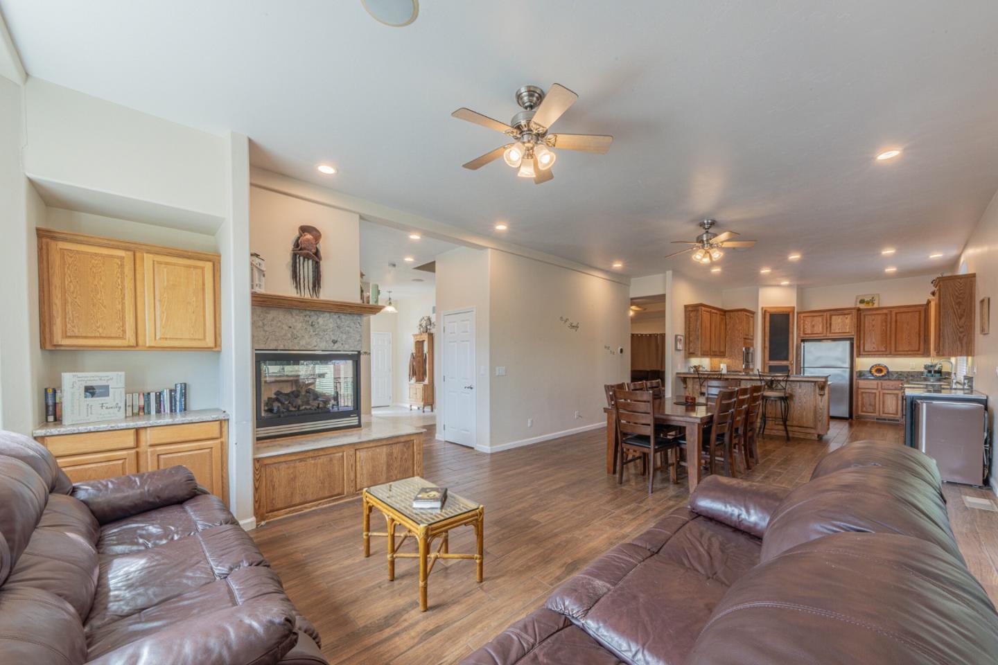 2188 Ridge Rider Road Bradley, CA 93426 - Photo 18 of 47 a living room with furniture dining table and a fireplace