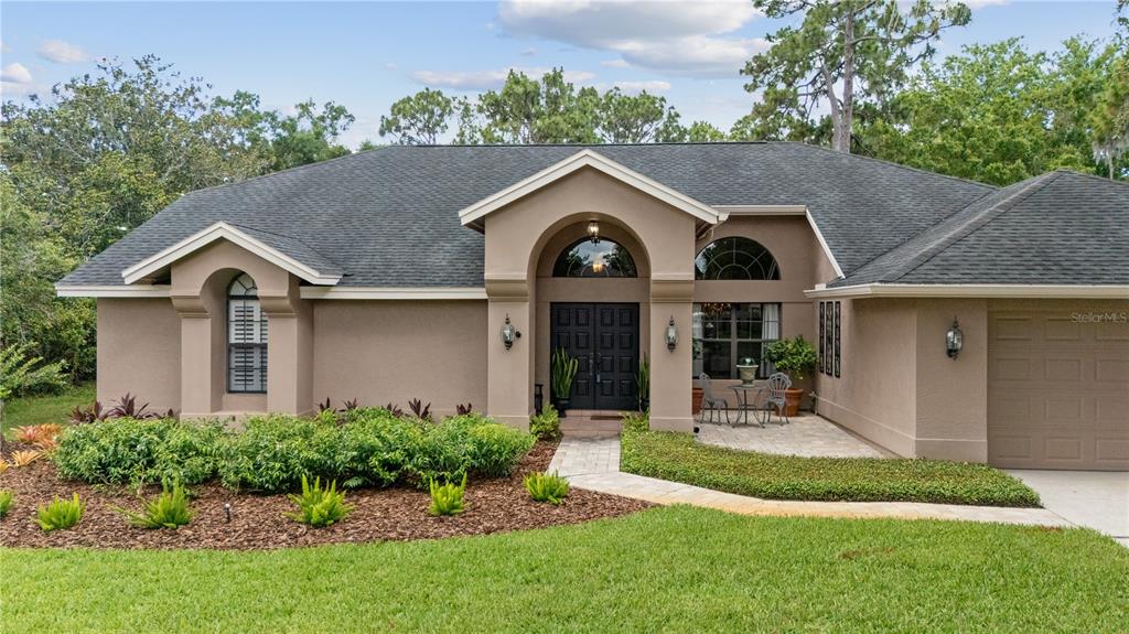 3372 Brian Road South Palm Harbor, FL 34685 - Photo 36 of 45 a front view of house with yard and green space