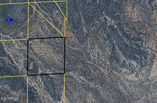 a close up of a street sign with a sign on it