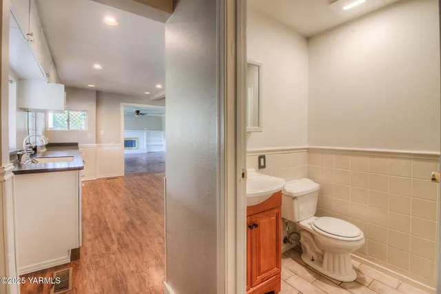 a bathroom with a toilet a sink and a shower