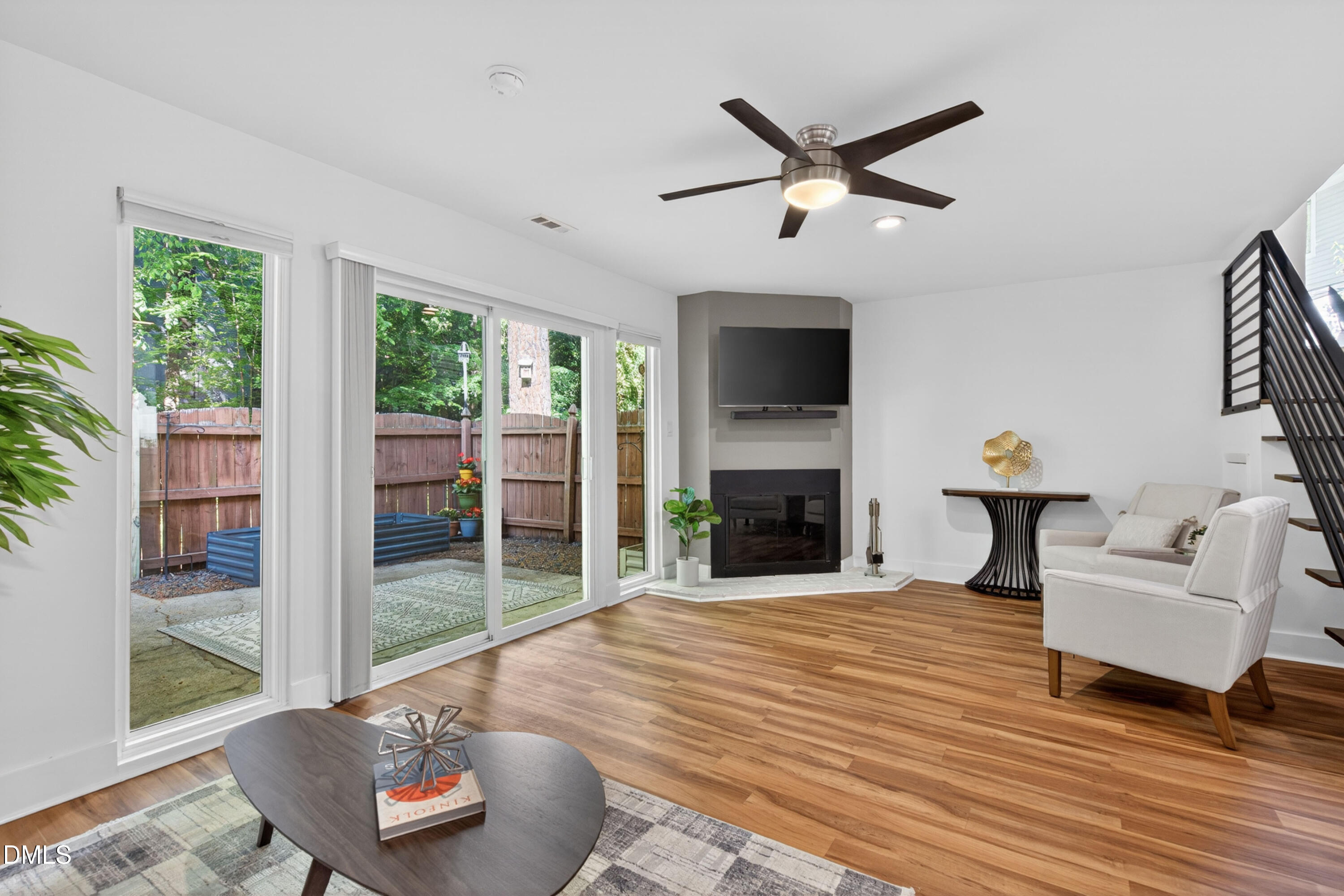 7149 Sandy Creek Drive Raleigh, NC 27615 - Photo 10 of 23 a living room with furniture and a fireplace