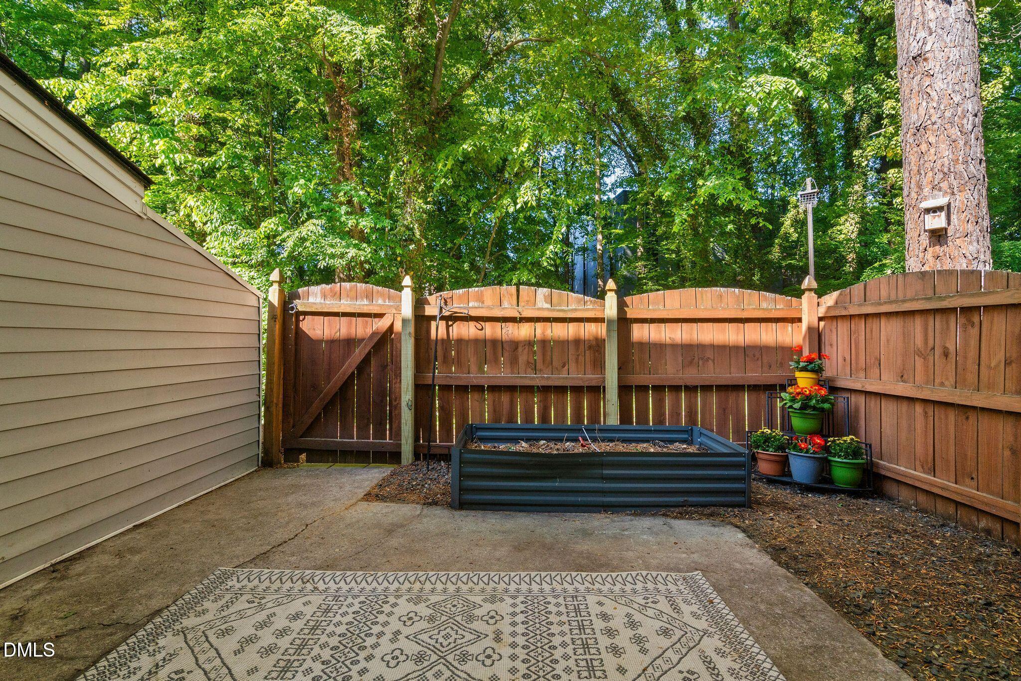 7149 Sandy Creek Drive Raleigh, NC 27615 - Photo 20 of 23 a view of outdoor space with deck and tree s