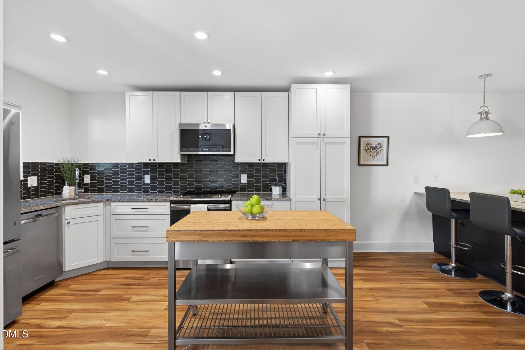 7149 Sandy Creek Drive Raleigh, NC 27615 - Photo 3 of 20 35_15-7149-sandy-creek-dr-kitchen