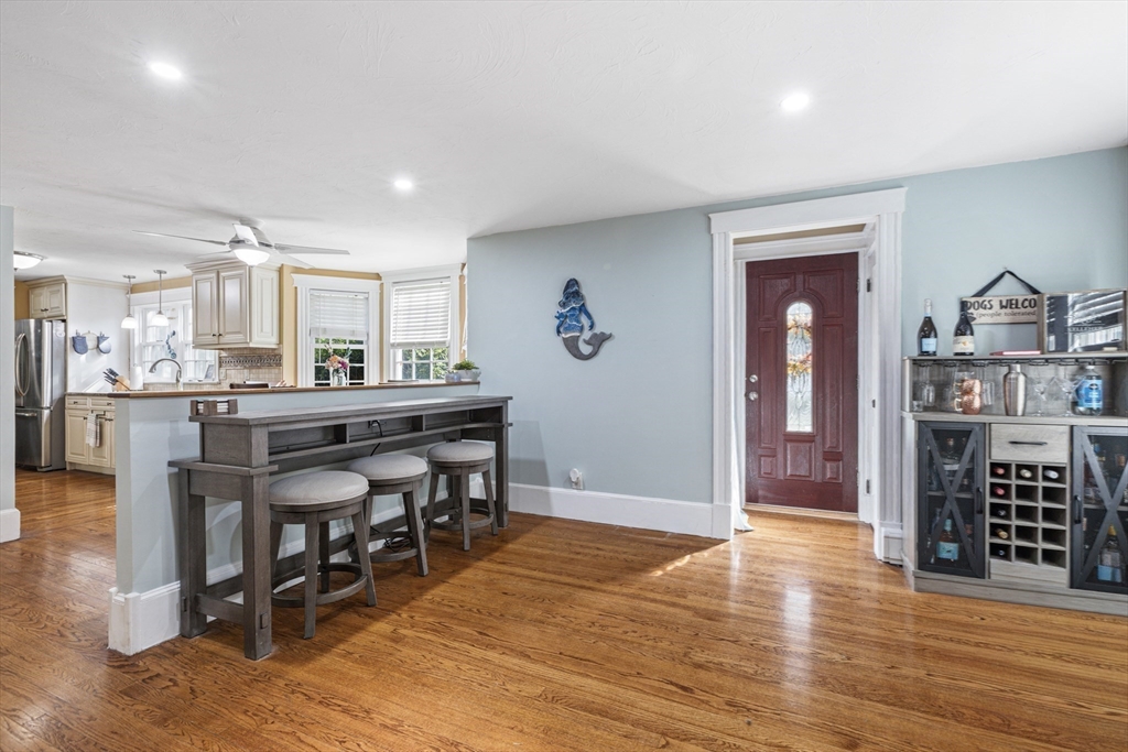 380 North Main Street Sharon, MA 02067 - Photo 14 of 35 a dining hall with stainless steel appliances granite countertop a table chairs and a refrigerator