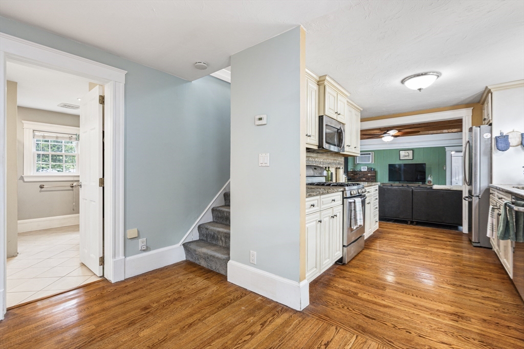 380 North Main Street Sharon, MA 02067 - Photo 18 of 35 a large kitchen with cabinets wooden floor and stainless steel appliances