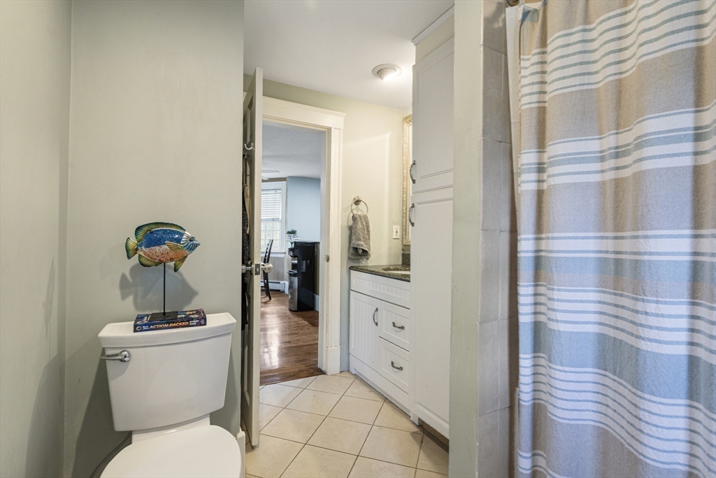 380 North Main Street Sharon, MA 02067 - Photo 20 of 35 a bathroom with a toilet a sink and a mirror