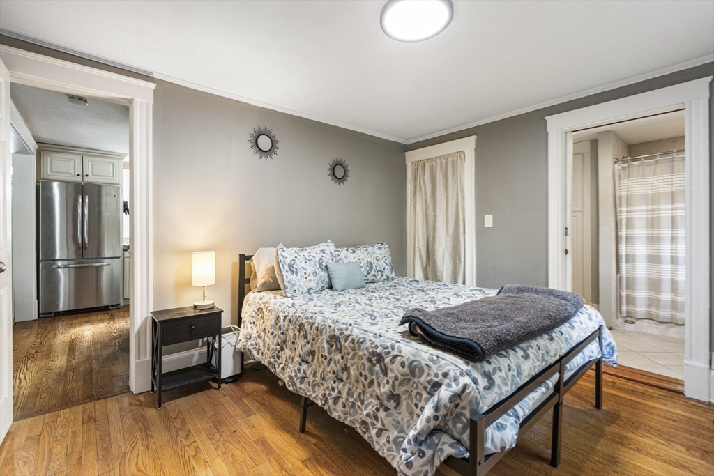 380 North Main Street Sharon, MA 02067 - Photo 22 of 35 a bedroom with a bed and a dresser