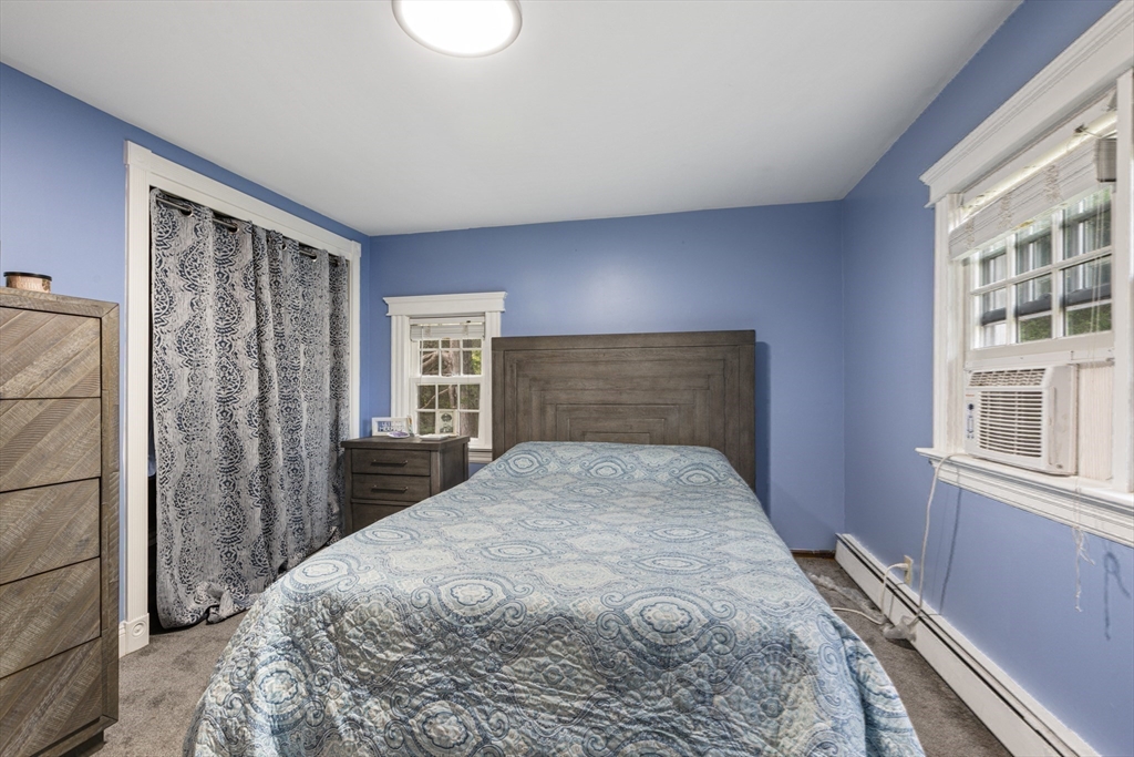 380 North Main Street Sharon, MA 02067 - Photo 25 of 35 a bed sitting in a bedroom next to a window