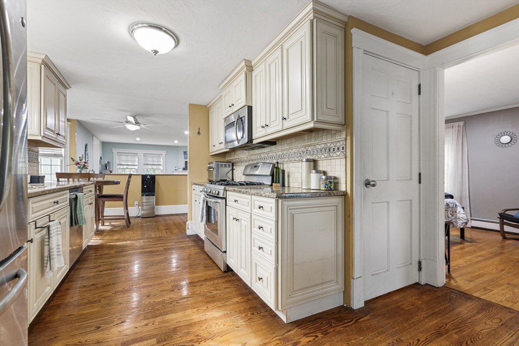380 North Main Street Sharon, MA 02067 - Photo 9 of 35 a kitchen with white cabinets and sink