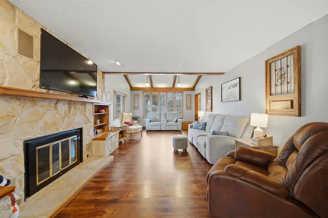 a living room with furniture and a fireplace