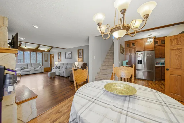 a view of a dining room and hall with furniture