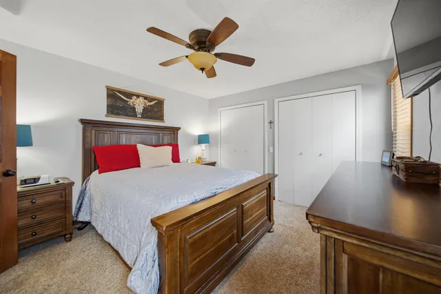 a bed room with a bed and a chandelier