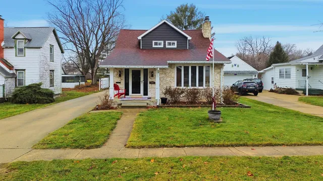 a view of a house with a yard porch and sitting area