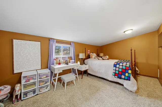 a bathroom with a granite countertop toilet a sink and a shower